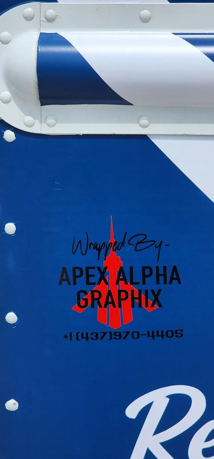 Wrapped by Apex Alpha Graphix credit decal on The Little Manitou Grill food truck