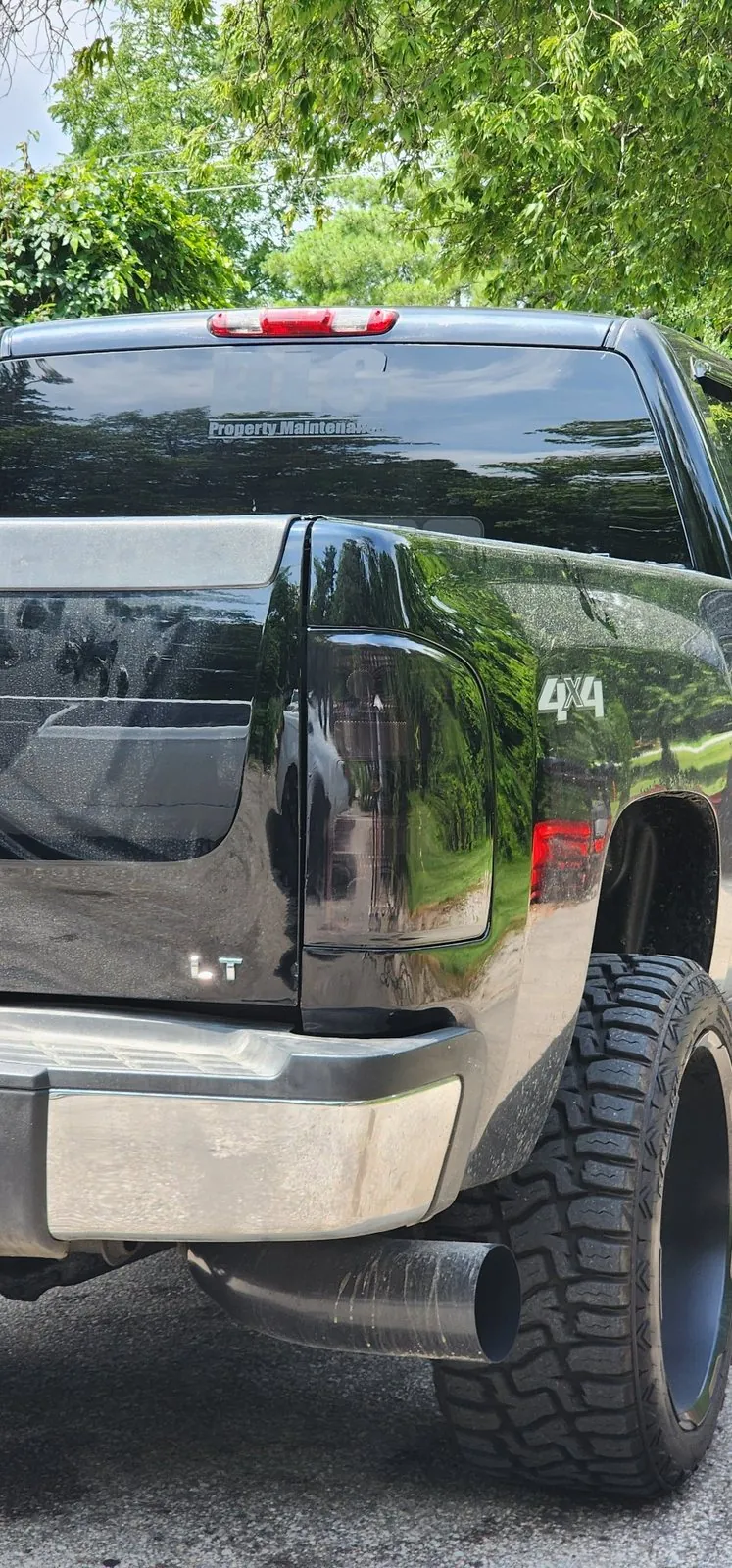 Smoked taillight tint on a Silverado at an angle