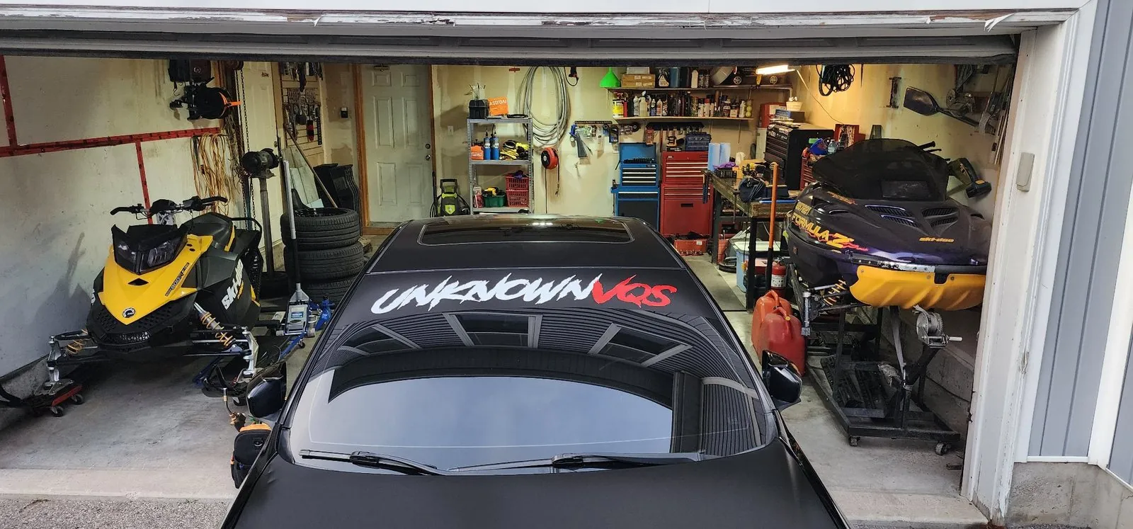 Windshield banner fitted on a car at a shop
